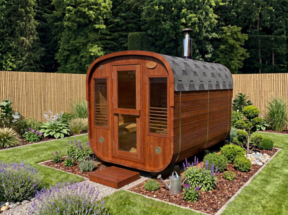 Wooden shepherd's hut in a garden setting with greenery and a wooden fence.